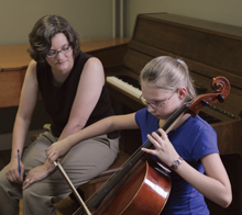 Dr. Karen Sunaback teaches a young cello student